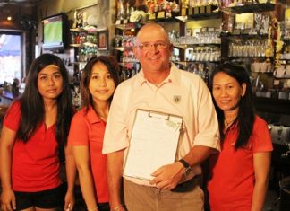 Brad Sproxton (2nd right) celebrates his win at Bangpra on Wednesday with the staff at The Golf Club.